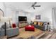 Inviting living room with a neutral palette, ceiling fan, stylish decor and lots of seating for entertaining guests at 1021 Shellbank Dr, Durham, NC 27703