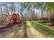 Large backyard with playset, providing ample space for recreation at 106 Alder Pl, Chapel Hill, NC 27517