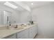 Double vanity bathroom with a large mirror at 106 Alder Pl, Chapel Hill, NC 27517