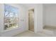 Bathroom with shower and large window at 106 Alder Pl, Chapel Hill, NC 27517