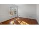 Well-lit bedroom with hardwood floors and window at 106 Alder Pl, Chapel Hill, NC 27517