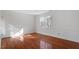 Bedroom with hardwood floors and large window at 106 Alder Pl, Chapel Hill, NC 27517