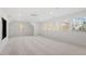Large bonus room with carpet, multiple windows, and abundant natural light at 106 Alder Pl, Chapel Hill, NC 27517
