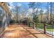 Large deck overlooks fenced backyard with playground at 106 Alder Pl, Chapel Hill, NC 27517