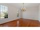 Bright dining room with hardwood floors and elegant chandelier at 106 Alder Pl, Chapel Hill, NC 27517