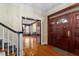 Bright entryway with hardwood floors and staircase at 106 Alder Pl, Chapel Hill, NC 27517