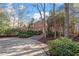 Brick home with a circular driveway and landscaping at 106 Alder Pl, Chapel Hill, NC 27517