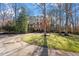 Two-story brick home nestled among trees at 106 Alder Pl, Chapel Hill, NC 27517