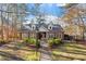 Brick home with landscaped front yard, fountain, and walkway at 106 Alder Pl, Chapel Hill, NC 27517