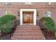 Brick steps leading to a double wooden door at 106 Alder Pl, Chapel Hill, NC 27517