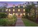 Charming brick home with manicured landscaping, a welcoming entrance, and classic architectural details at 106 Alder Pl, Chapel Hill, NC 27517