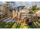 Brick house with deck and screened porch in wooded setting at 106 Alder Pl, Chapel Hill, NC 27517