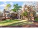 Brick house exterior showcasing screened porch and backyard at 106 Alder Pl, Chapel Hill, NC 27517
