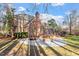 Brick house with large deck, patio and expansive backyard at 106 Alder Pl, Chapel Hill, NC 27517