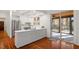 Kitchen with island, stainless steel appliances, and access to patio at 106 Alder Pl, Chapel Hill, NC 27517