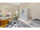 Charming kitchenette with vintage white cabinets and black and white tile floor at 106 Alder Pl, Chapel Hill, NC 27517