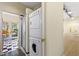 Laundry room features stackable washer and dryer, shower, and access to a sunroom at 106 Alder Pl, Chapel Hill, NC 27517
