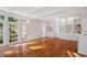 Spacious living room with hardwood floors, built-in shelving, and abundant natural light at 106 Alder Pl, Chapel Hill, NC 27517