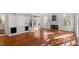Sunlit living room with hardwood floors and built-in shelving at 106 Alder Pl, Chapel Hill, NC 27517