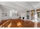 Spacious living room with hardwood floors, built-in shelving, and fireplace at 106 Alder Pl, Chapel Hill, NC 27517