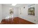 Well-lit office space with hardwood floors and multiple windows at 106 Alder Pl, Chapel Hill, NC 27517
