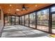 Spacious screened porch with ceiling fans and views of the backyard at 106 Alder Pl, Chapel Hill, NC 27517