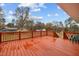 Spacious wooden deck with red railing offers space for relaxing and entertaining at 670 Mcadams Rd, Hillsborough, NC 27278