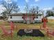 Inviting home exterior with a charming fire pit area and comfortable seating, perfect for outdoor enjoyment at 670 Mcadams Rd, Hillsborough, NC 27278