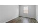 Cozy bedroom with neutral walls, a window with blinds, and sleek flooring at 107 Ethel Ln, Angier, NC 27501