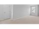 Neutral bedroom featuring plush carpeting, and a bright window at 107 Ethel Ln, Angier, NC 27501