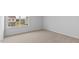 Bedroom with neutral carpeting, bright natural light, with views of the neighborhood at 107 Ethel Ln, Angier, NC 27501