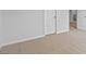 Bedroom showing neutral carpeting, with bright natural light, and white doors and trim at 107 Ethel Ln, Angier, NC 27501