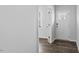 A bright entryway featuring sleek flooring and a white front door, with a glimpse into adjacent rooms at 107 Ethel Ln, Angier, NC 27501