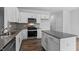 Well-equipped kitchen boasts stainless appliances, center island, and sleek countertops at 107 Ethel Ln, Angier, NC 27501