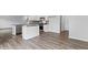Kitchen with stainless steel appliances, gray countertops, and a center island at 107 Ethel Ln, Angier, NC 27501