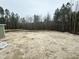 Large, level backyard backing to wooded area at 136 Bar Code Ct, Wendell, NC 27591