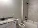 Freshly renovated bathroom boasts a granite countertop sink, a toilet, and shower-tub combo at 136 Bar Code Ct, Wendell, NC 27591