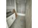 Bathroom with bathtub and shower, vanity and neutral tiling at 136 Bar Code Ct, Wendell, NC 27591