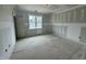Bright bedroom with window, featuring unfinished drywall, offering a canvas for personalization at 136 Bar Code Ct, Wendell, NC 27591