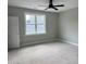Bright bedroom with a large window, offering a tranquil space bathed in natural light for relaxation and comfort at 136 Bar Code Ct, Wendell, NC 27591
