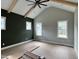 Bedroom featuring vaulted ceiling, accent wall, and lots of natural light from multiple windows at 136 Bar Code Ct, Wendell, NC 27591