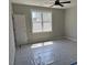 Bedroom with a new window allowing plenty of light, and a door on the left side at 136 Bar Code Ct, Wendell, NC 27591