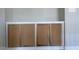 Built-in storage cabinet featuring four wood doors, offering a blend of style and functionality at 136 Bar Code Ct, Wendell, NC 27591