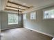 Dining room with ceiling beams and lots of natural light from large windows at 136 Bar Code Ct, Wendell, NC 27591