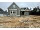 Newly constructed home with olive siding, grey brick and a covered front entrance at 136 Bar Code Ct, Wendell, NC 27591