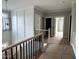 Upstairs hallway with wainscotting that leads to bedrooms; blends traditional style with modern design at 136 Bar Code Ct, Wendell, NC 27591