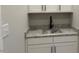 Powder room features white cabinets, granite countertop, and modern black faucet at 136 Bar Code Ct, Wendell, NC 27591