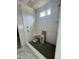 Modern shower with stylish tile, built-in corner shelf, and sleek fixtures, offering a luxurious experience at 136 Bar Code Ct, Wendell, NC 27591