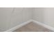 Interior view of a closet with carpet flooring, white base trim, and wire shelving for optimal storage at 2317 Forsythia Trl, Fuquay Varina, NC 27526