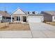 Charming single-Gathering home with a two-car garage and well-manicured front yard in a suburban neighborhood at 2317 Forsythia Trl, Fuquay Varina, NC 27526